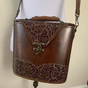 Handcrafted tooled leather handbag